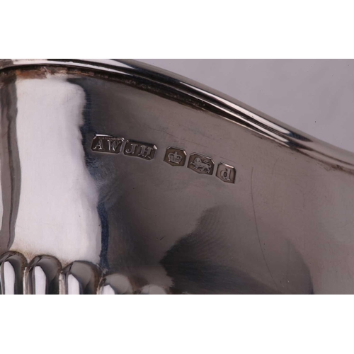 484 - A George IV-style three-piece silver tea set, with makers mark A W | J H, Sheffield 1921, of oval fo... 