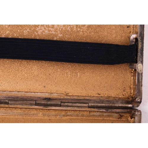 486 - A silver cigarette case, By Inman Manufacturing Co, Birmingham 1942, of rectangular form with engine... 