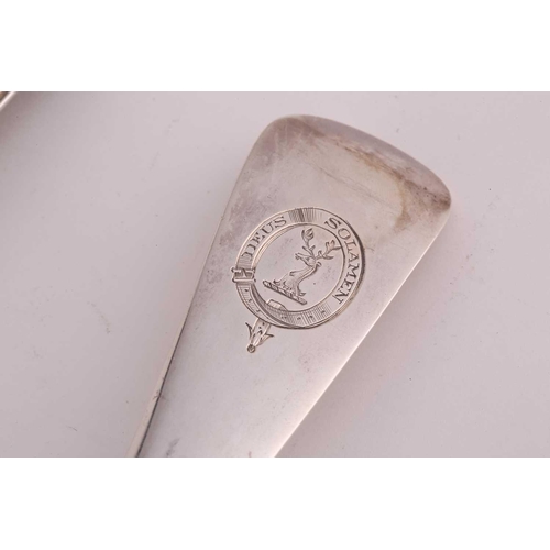 488 - A Victorian silver straining spoon, fiddle and thread pattern, London 1852 by George Adams; together... 