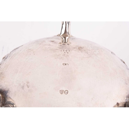 489 - A Victorian silver bowl decorated with flowers and C scrolls around a vacant cartouche, with a beade... 