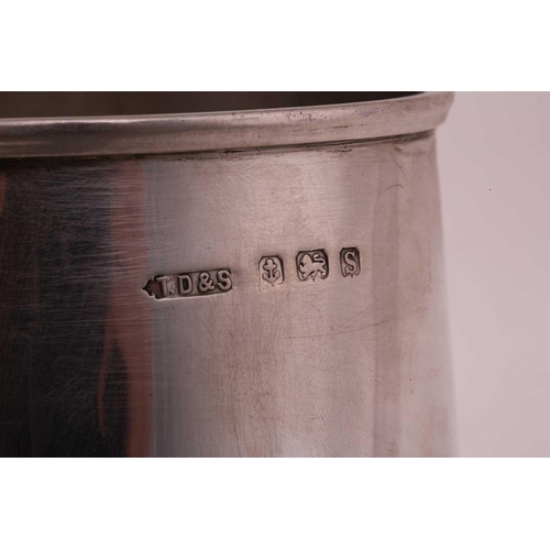 492 - A silver tankard of plain tapering cylindrical form the handle with inverted thumb piece, 11.5cm hig... 