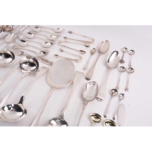 496 - A mixed quantity of silver flatware including a set of six George III tea spoons with bright cut dec... 