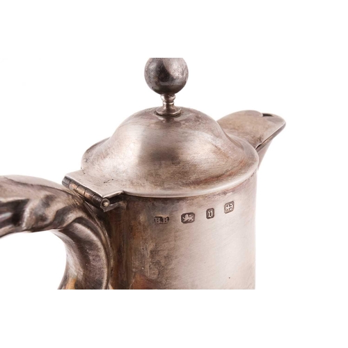 502 - A Victorian silver mounted claret jug; the domed cover with ball finial; leaf- capped scroll handle ... 