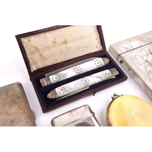 503 - A carved mother of pearl card case, a silver and guillché enamel compact, a naval cigarette case, a ... 