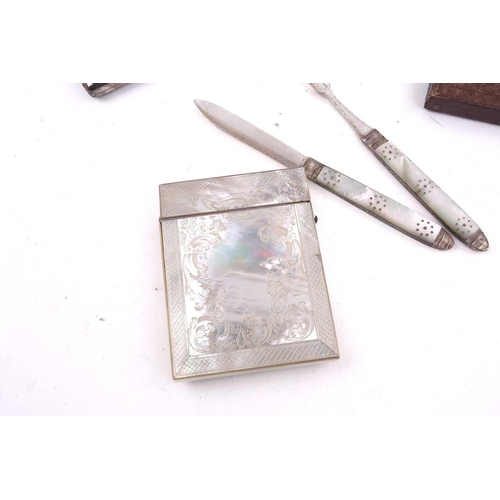 503 - A carved mother of pearl card case, a silver and guillché enamel compact, a naval cigarette case, a ... 