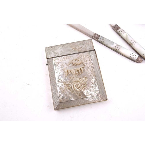 503 - A carved mother of pearl card case, a silver and guillché enamel compact, a naval cigarette case, a ... 