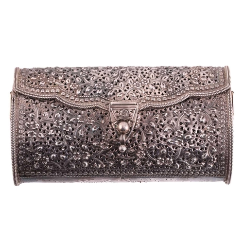504 - A white metal clutch bag; chased and pierced foliate decoration; hinged cover and hinged clasp.Stamp... 