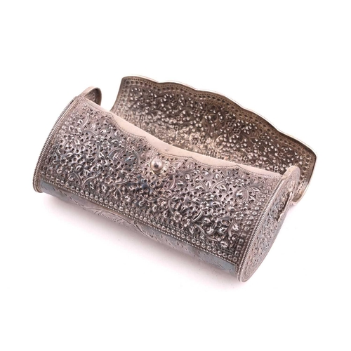 504 - A white metal clutch bag; chased and pierced foliate decoration; hinged cover and hinged clasp.Stamp... 