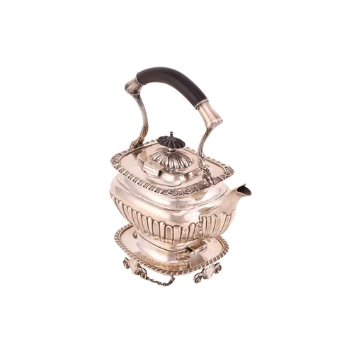 505 - An Edwardian silver teapot and stand, of rectangular gadrooned form with ebony handle, engraved init... 