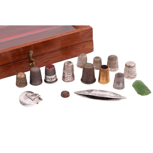506 - A collection of thimbles of varying dates, including an enamelled decorated example, a gilded exampl... 