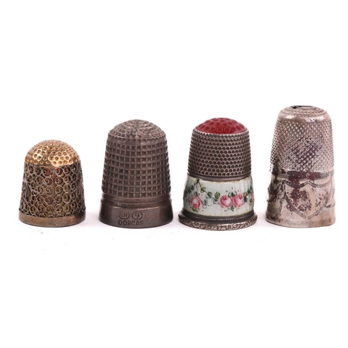 506 - A collection of thimbles of varying dates, including an enamelled decorated example, a gilded exampl... 