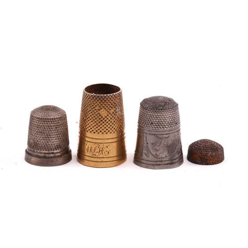 506 - A collection of thimbles of varying dates, including an enamelled decorated example, a gilded exampl... 
