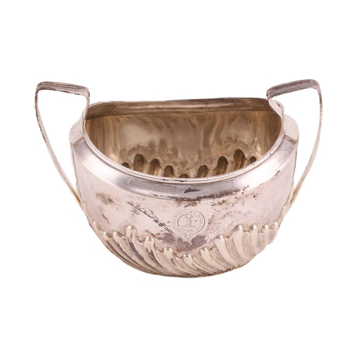 507 - A Victorian silver part-fluted teapot with angular ebonised handle, hinged cover and engraved crest ... 
