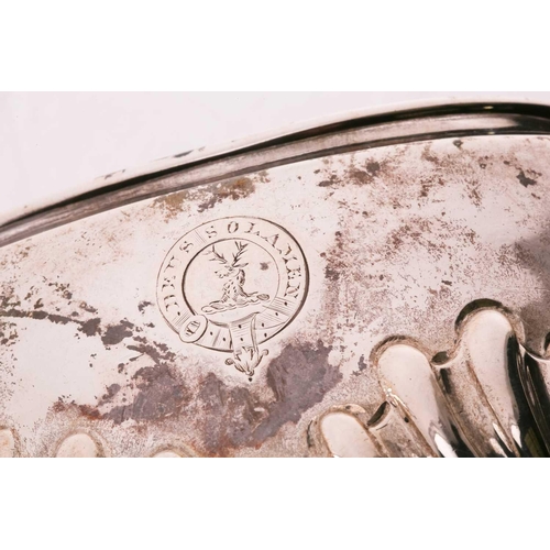 507 - A Victorian silver part-fluted teapot with angular ebonised handle, hinged cover and engraved crest ... 