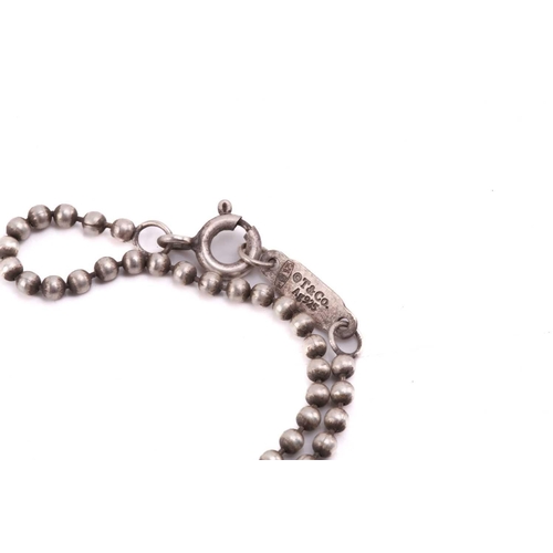 51 - Tiffany & Co. - an '1837 Makers' pendant on ball chain, the rectangular pendant laser engraved with ... 