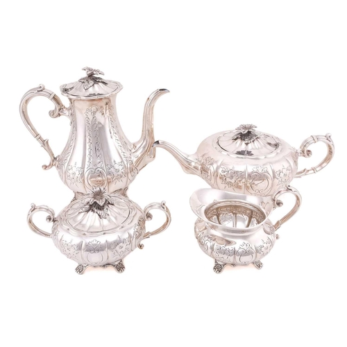 512 - A four piece tea and coffee set; lobed, low bellied panelled form, the panels engraved with foliage ... 