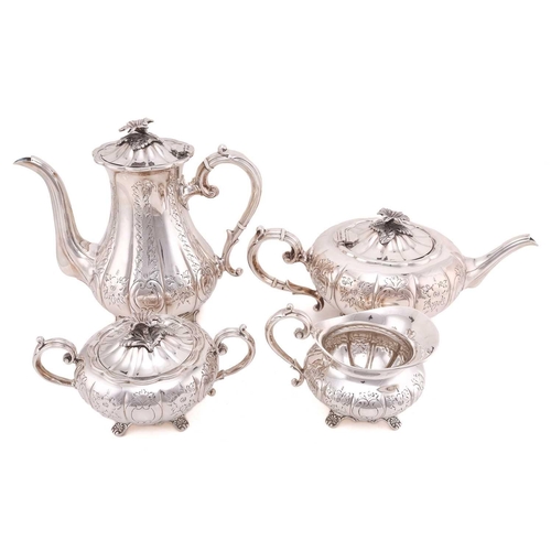 512 - A four piece tea and coffee set; lobed, low bellied panelled form, the panels engraved with foliage ... 