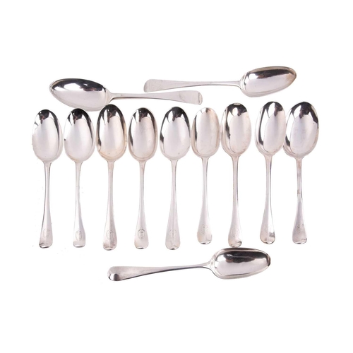 515 - A collection of twelve various silver table spoons, including a George I example by Samuel Hutton, L... 