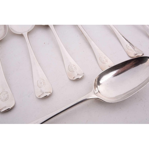 515 - A collection of twelve various silver table spoons, including a George I example by Samuel Hutton, L... 
