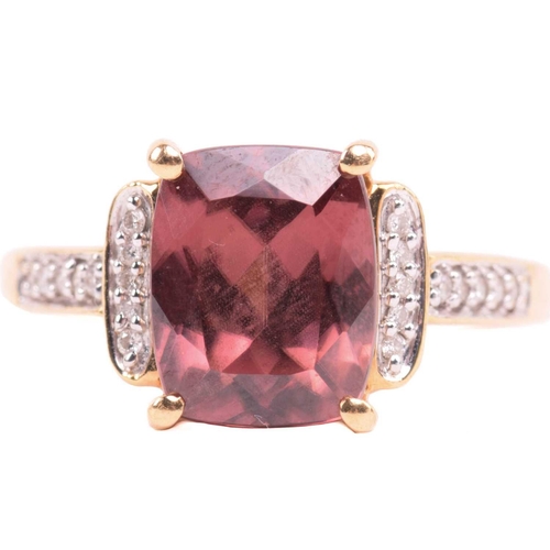 52 - A red zircon and diamond dress ring in 18ct yellow gold, centred with a cushion-cut red zircon in a ... 