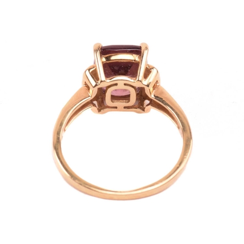 52 - A red zircon and diamond dress ring in 18ct yellow gold, centred with a cushion-cut red zircon in a ... 