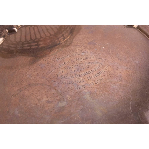 520 - A silver salver, of shaped square form, engraved to the centre, on four scroll feet, 27 cm, Sheffiel... 