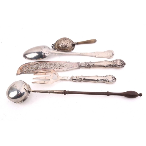 521 - A collection of assorted silver items comprising a Victorian Kings pattern serving spoon, a toddy la... 