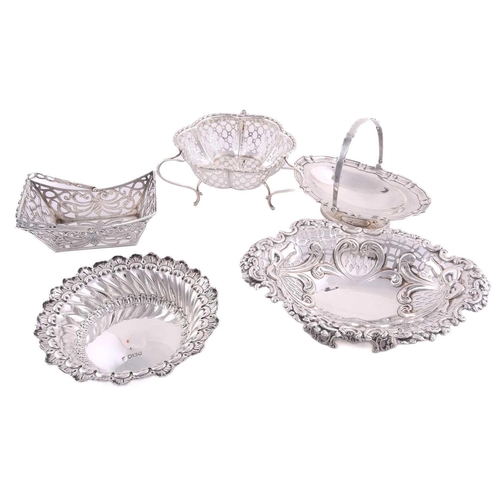 524 - Five assorted silver bon bon dishes comprising two with swing handles (the oval example with filled ... 