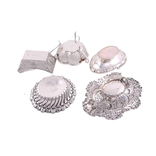 524 - Five assorted silver bon bon dishes comprising two with swing handles (the oval example with filled ... 