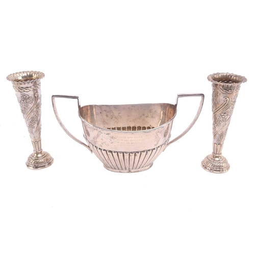 526 - A silver half-reeded sugar basin engraved with a dedication, 6.4ozt together with two weighted silve... 