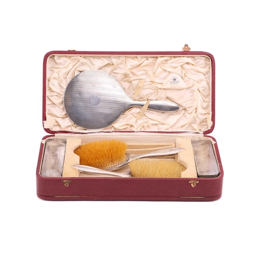 530 - A Mappin and Webb silver dressing set in its original fitted case comprising two hair brushes, two c... 