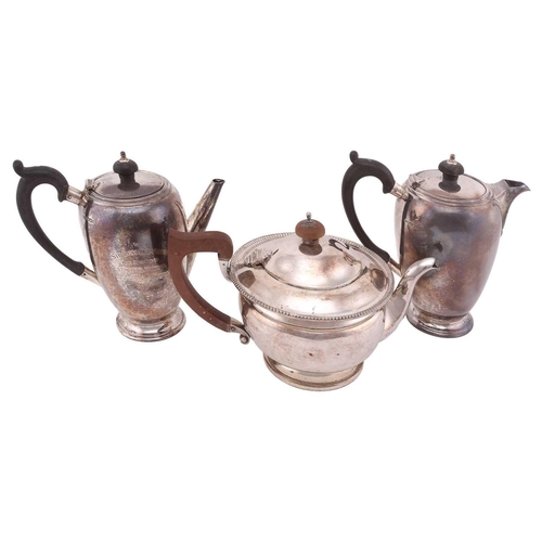 532 - A silver cafe au lait set, by Mappin and Webb, Sheffiled 1933, of curved tapered cylindrical form wi... 