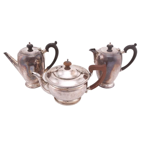 532 - A silver cafe au lait set, by Mappin and Webb, Sheffiled 1933, of curved tapered cylindrical form wi... 
