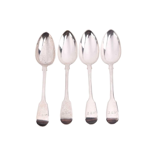 537 - A set of four William IV silver fiddle pattern serving spoons, each engraved with the initials M.D.T... 