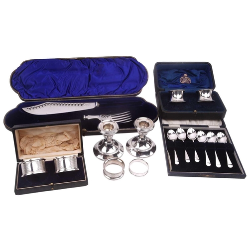 538 - A boxed pair of presentation silver napkin rings, a pair of silver-bladed fish servers (no handles),... 