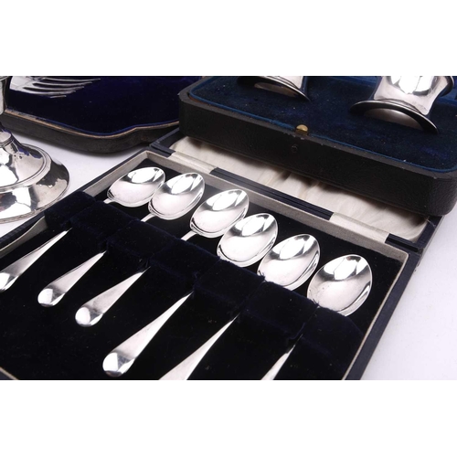 538 - A boxed pair of presentation silver napkin rings, a pair of silver-bladed fish servers (no handles),... 