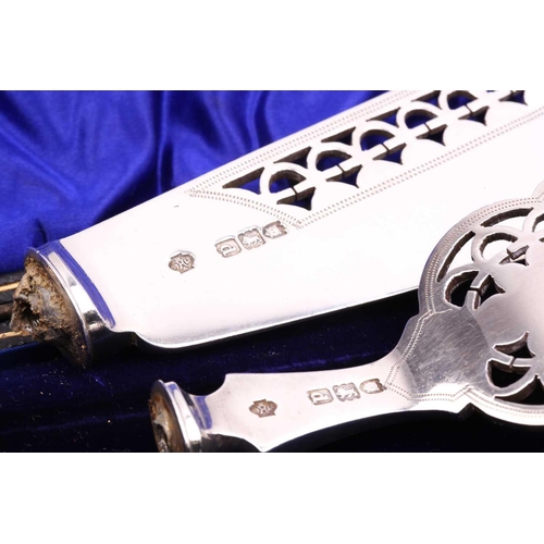 538 - A boxed pair of presentation silver napkin rings, a pair of silver-bladed fish servers (no handles),... 