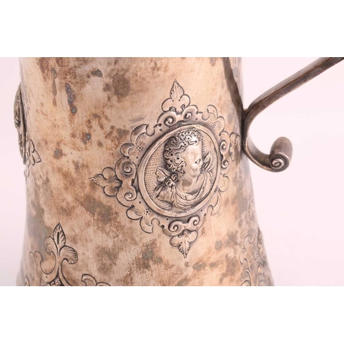542 - A Hungarian electroplated lidded tankard. Tapering cylindrical with reeded skirt foot; the body with... 