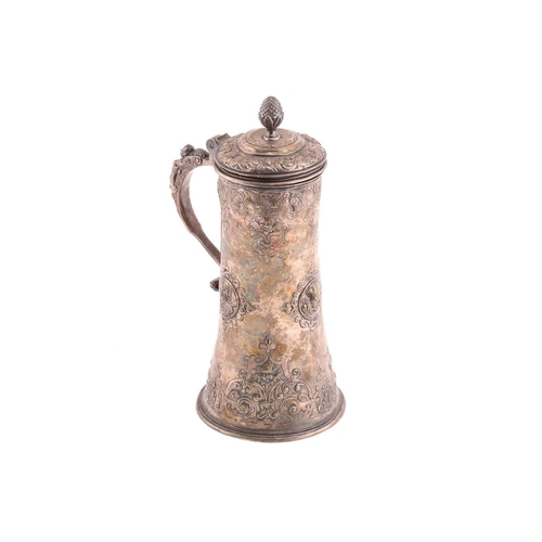 542 - A Hungarian electroplated lidded tankard. Tapering cylindrical with reeded skirt foot; the body with... 