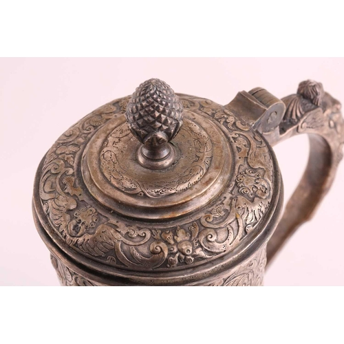 542 - A Hungarian electroplated lidded tankard. Tapering cylindrical with reeded skirt foot; the body with... 