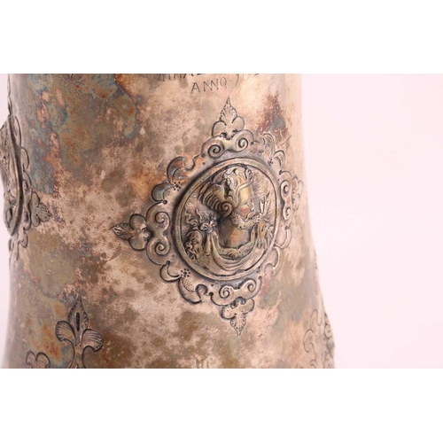 542 - A Hungarian electroplated lidded tankard. Tapering cylindrical with reeded skirt foot; the body with... 