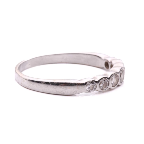 55 - A diamond seven stone half hoop eternity ring, featuring a row of round brilliant cut diamonds with ... 
