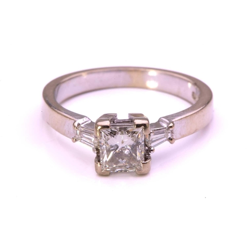 59 - A princess-cut diamond solitaire ring in 9ct white gold, comprising a rectangular princess-cut diamo... 