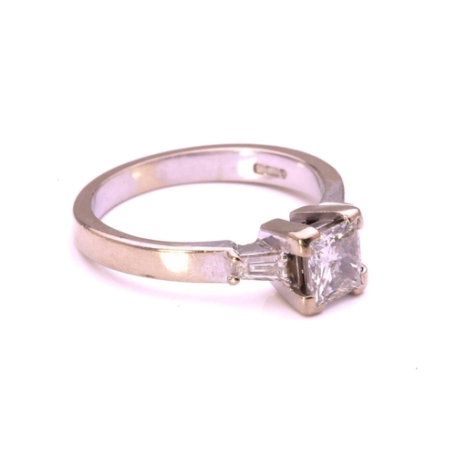 59 - A princess-cut diamond solitaire ring in 9ct white gold, comprising a rectangular princess-cut diamo... 