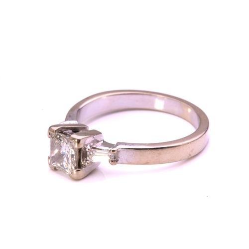 59 - A princess-cut diamond solitaire ring in 9ct white gold, comprising a rectangular princess-cut diamo... 