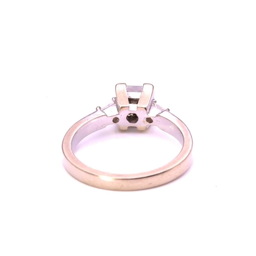 59 - A princess-cut diamond solitaire ring in 9ct white gold, comprising a rectangular princess-cut diamo... 