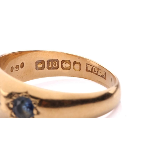 60 - An Edwardian three-stone sapphire gypsy ring in 18ct gold, star-set with three graduated circular-cu... 