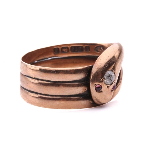 8 - A Victorian snake ring, set with an old cut diamond to the head and red gem-set eyes, in rose gold w... 