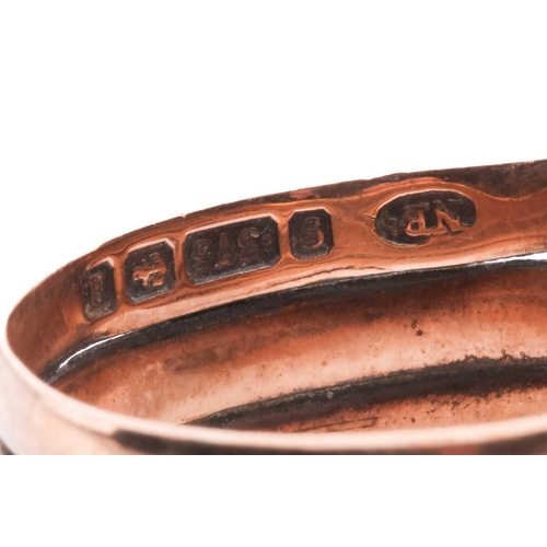 8 - A Victorian snake ring, set with an old cut diamond to the head and red gem-set eyes, in rose gold w... 