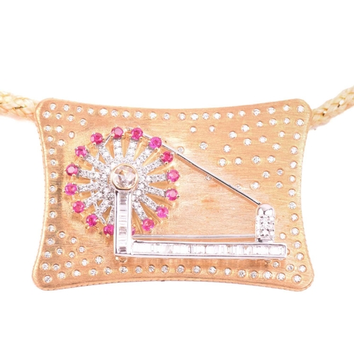 9 - An Indian spinning wheel pendant set with ruby and diamond, featuring an articulated spinning wheel ... 